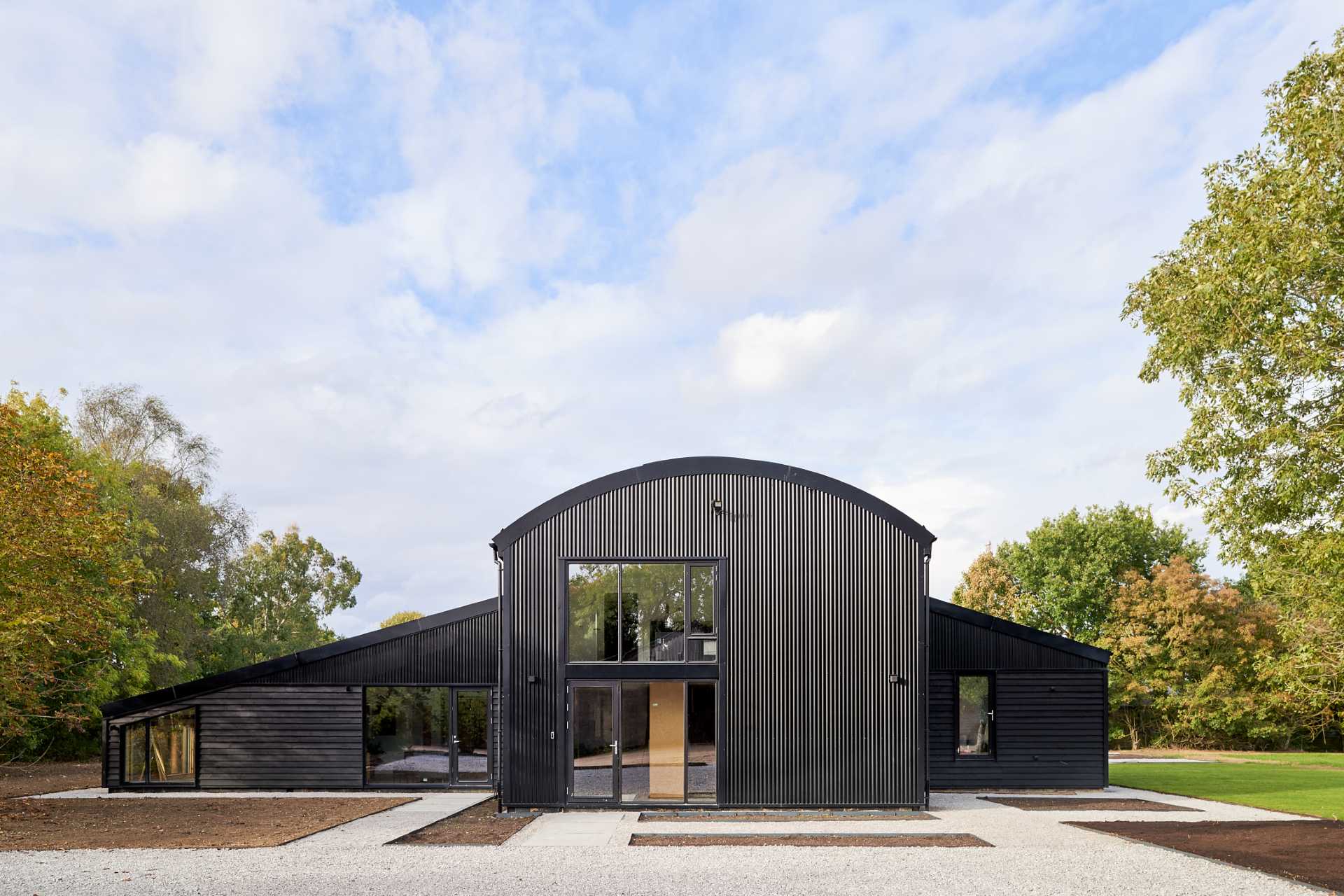 A modern barn-inspired home with a black exterior.