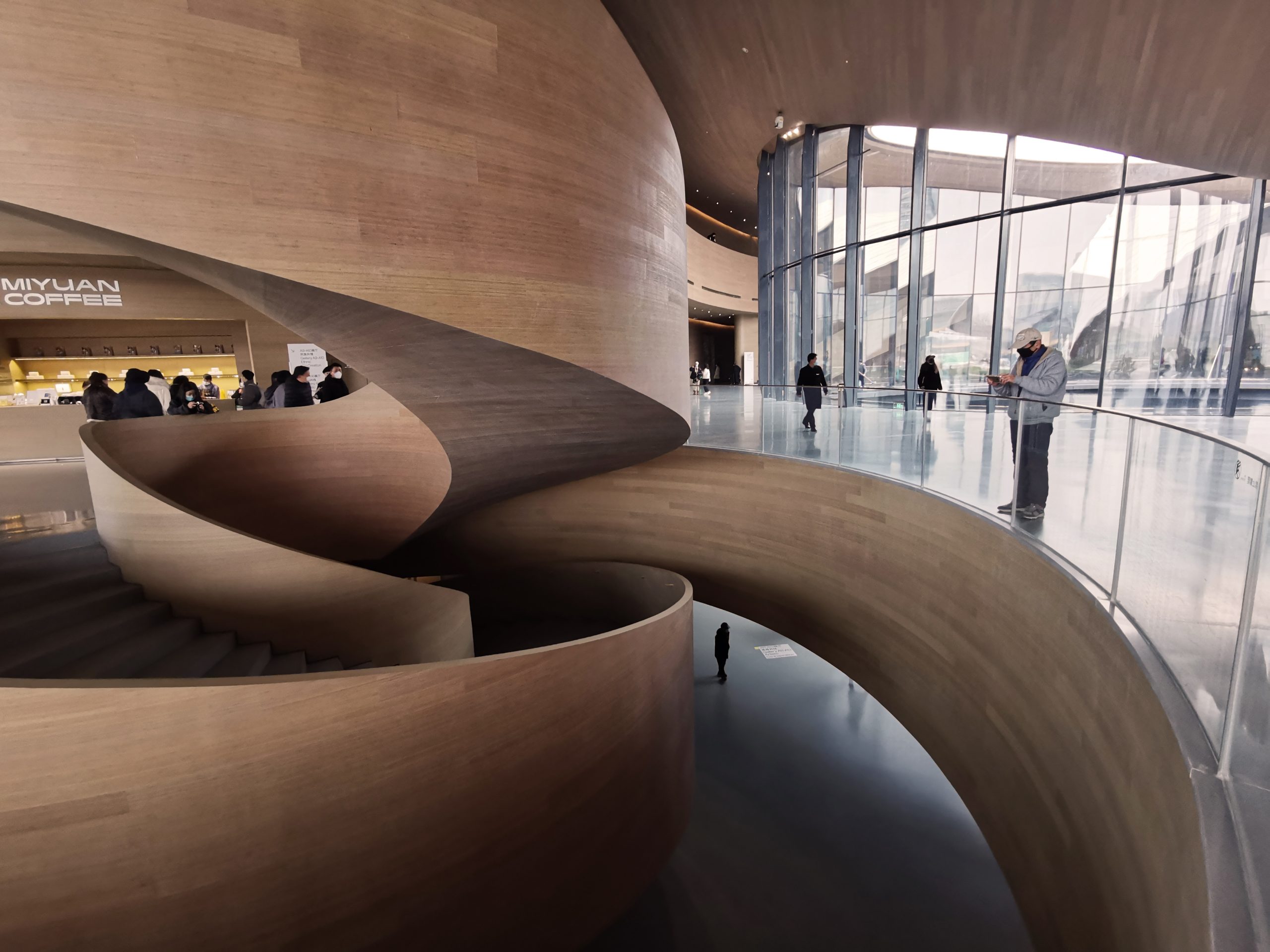 water-inspired architecture, riverfront buildings, urban design, modern Chinese architecture, tranquil environments, architectural aesthetics, public spaces, innovative structures, landscape and architecture, iconic projects