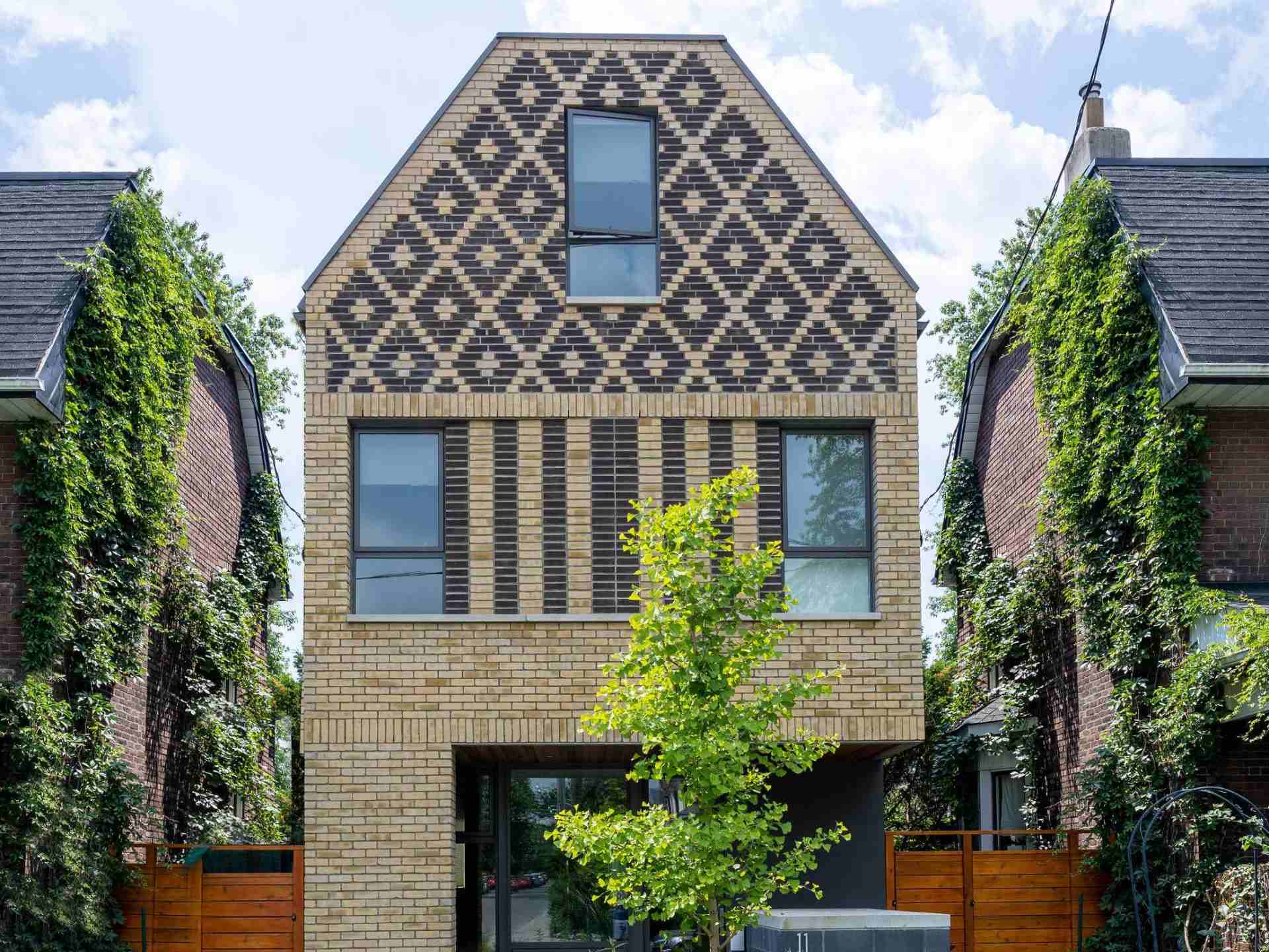 A contemporary home in Toronto, Canada, with diamond patterned brickwork on its facade.
