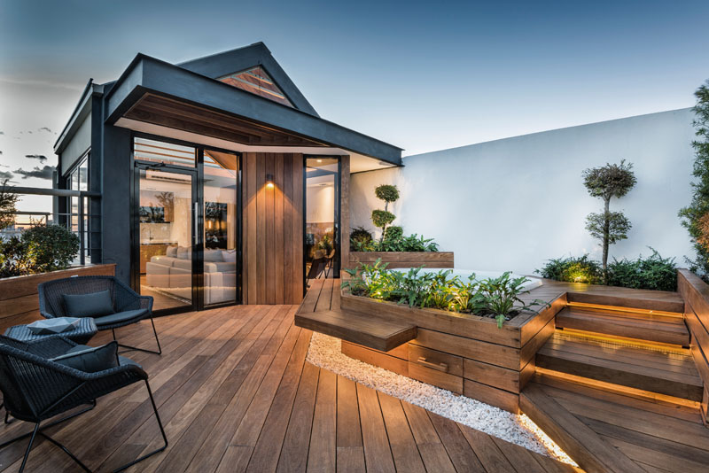 This “hut in the sky” brings plants and natural touches to a rooftop escape.