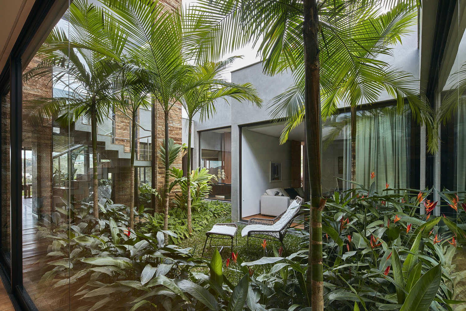 A Brazilian hilltop home rich in natural materials and personal touches, celebrating family life and connection to the landscape.