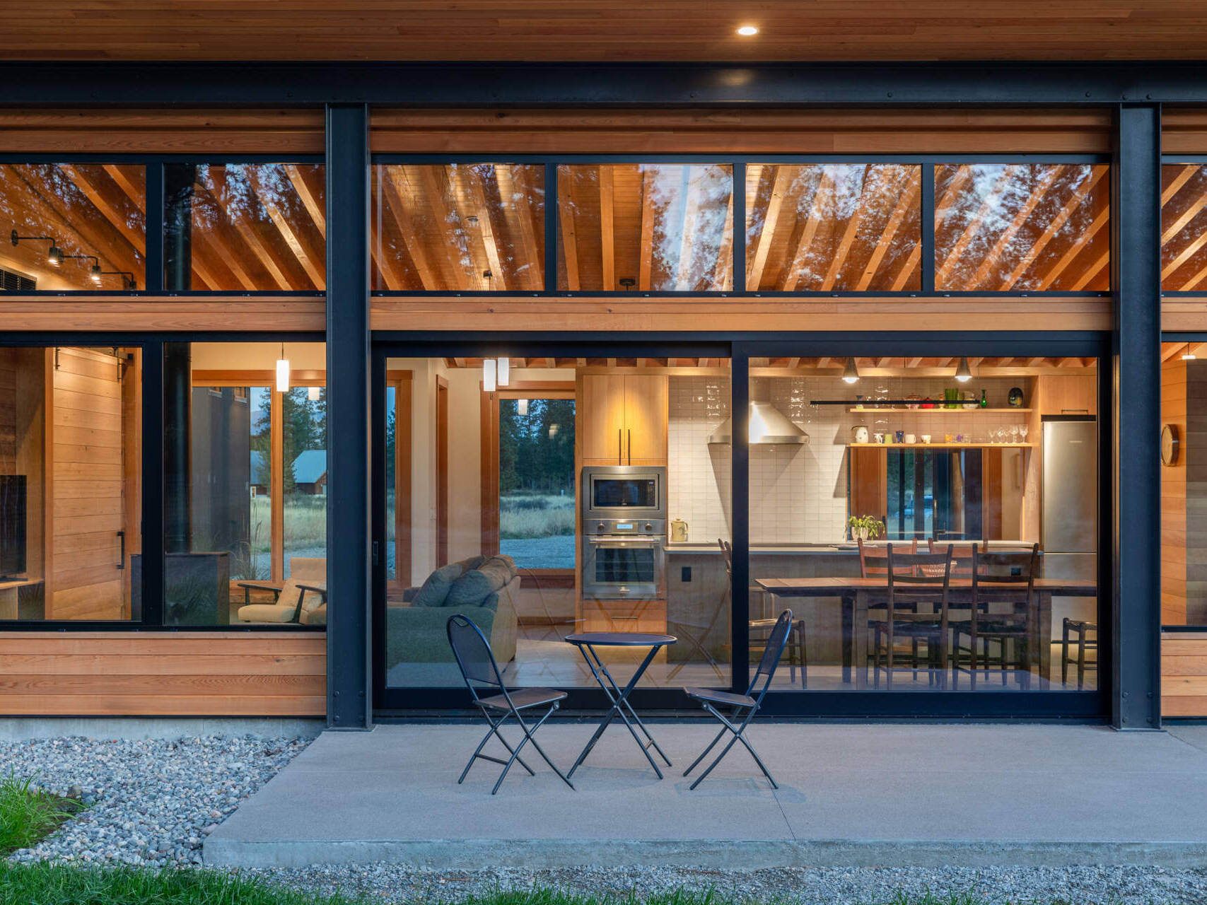 Cedar, glass, and metal combine to give this home a layered, natural look that blends with the surrounding landscape.
