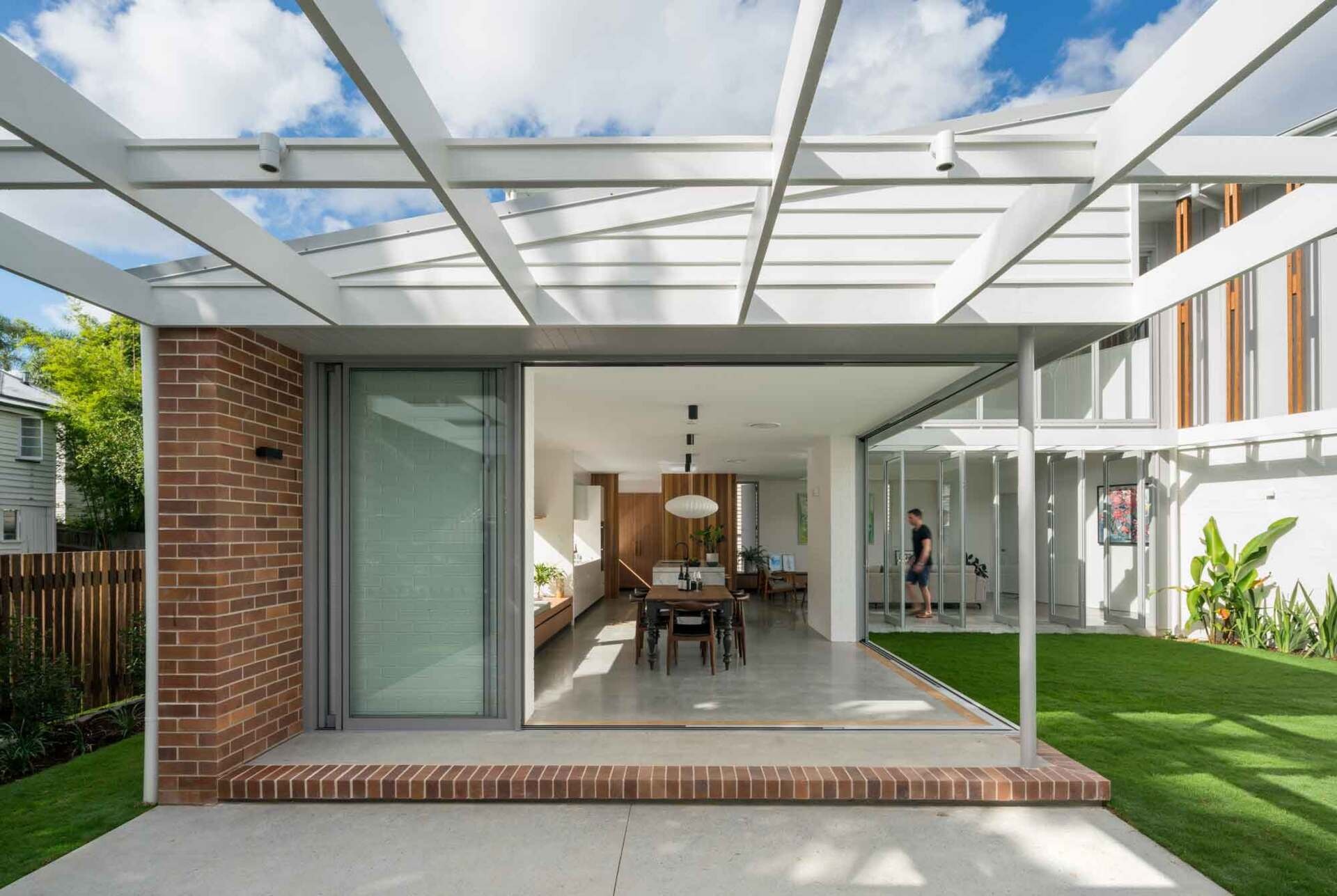 Ground floor living spaces open directly to outdoor areas designed for everyday family life.
