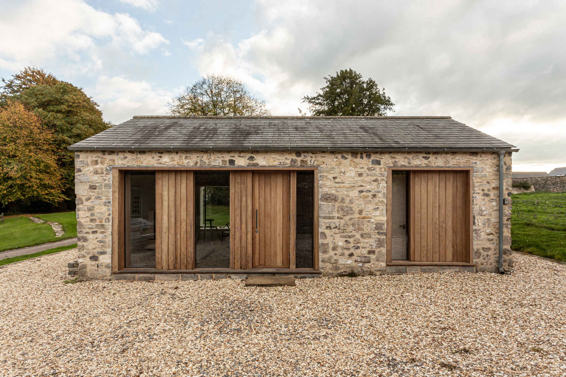 See how a Grade II listed pig sty becomes a contemporary holiday stay with stone walls, oak accents and a crafted plywood core.