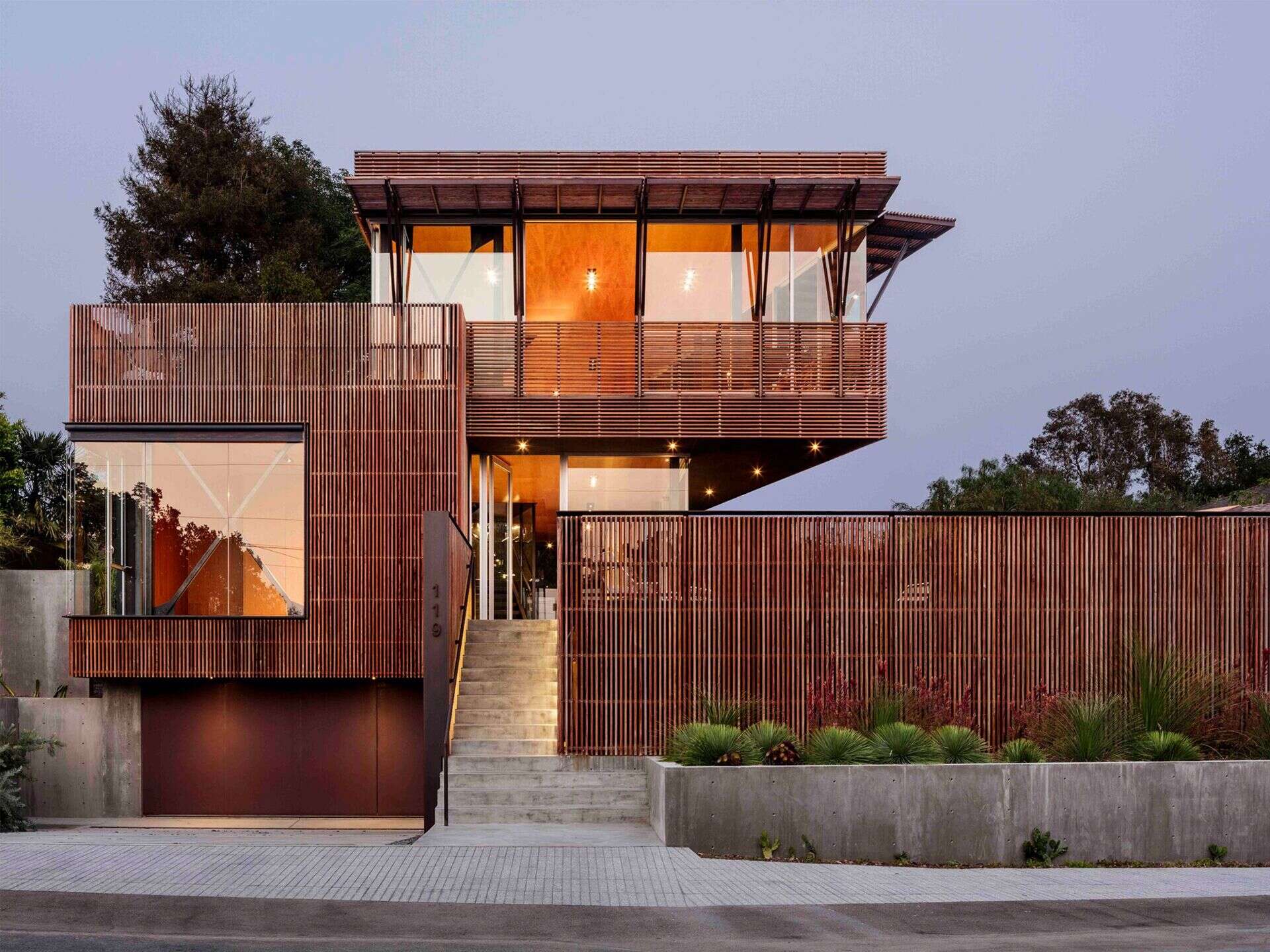 Concrete, steel and Ipe wood come together in this modern California home, combining durability with passive cooling and filtered light.